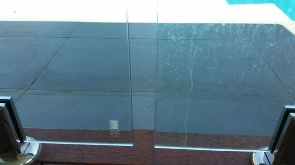 Michael Wheatley - Cleaning Swimming Pool Glass Panels - Before (right panel) After (left panel)